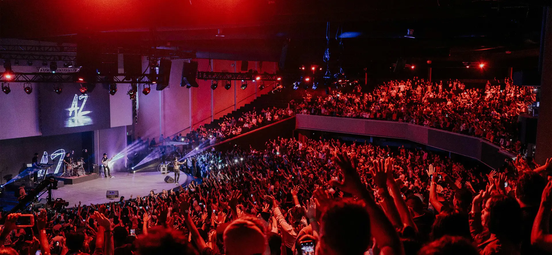 A large crowd of people in an auditorium.